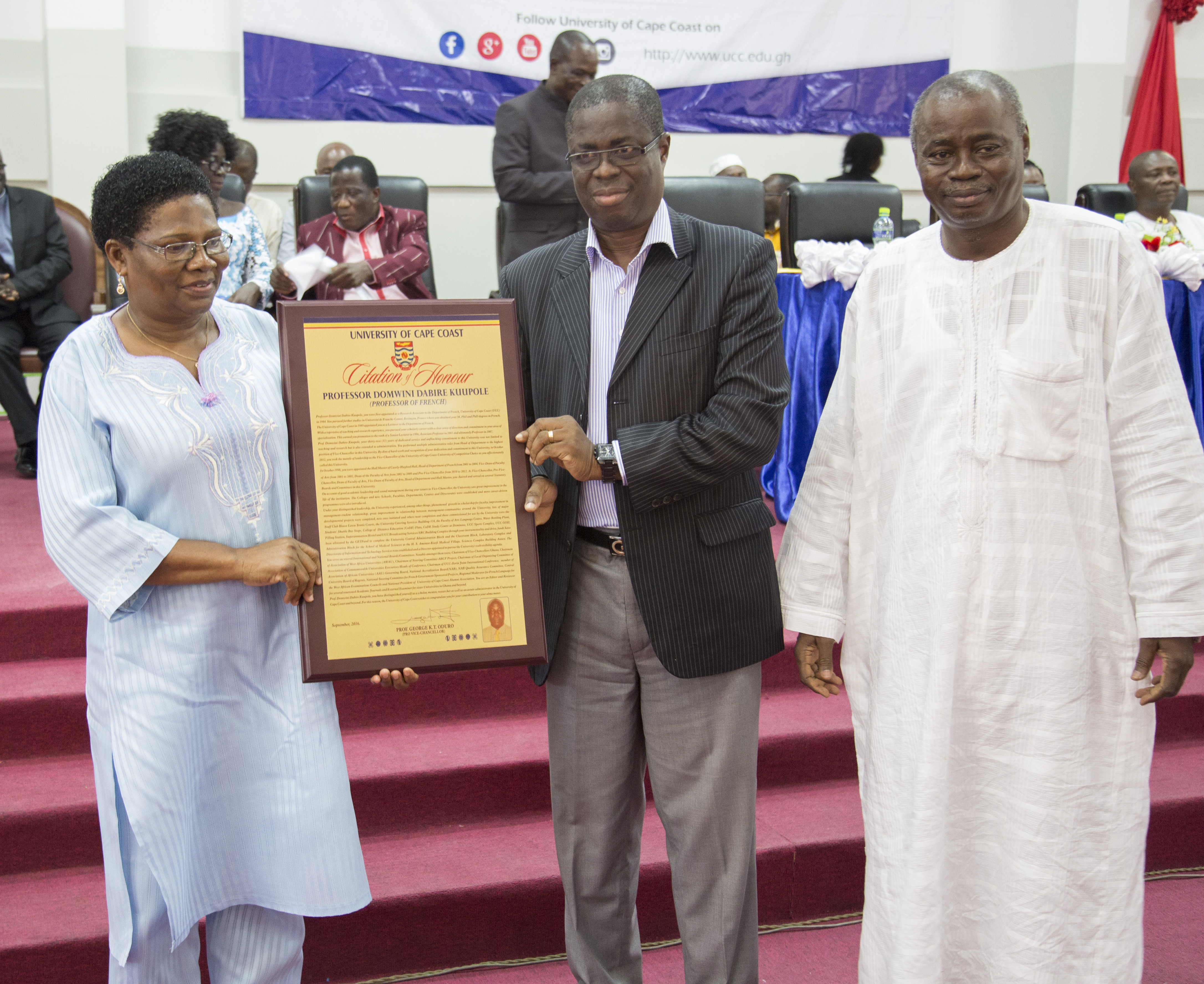 Dr Mrs Alfredina Kuupole (left) receiving a memento on behalf of Prof. Domwini Dabire Kuupole from Professor Joseph Ampiah Ghartey, incoming Vice Chancellor looking on Prof. S.B. Kendie, former Provost of the College of Humanities and Legal Studies (right).